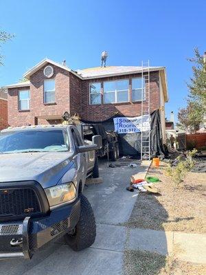 Roof replacement.  Truck and trailer to take away the old roof.