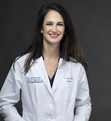 Dr. Mina