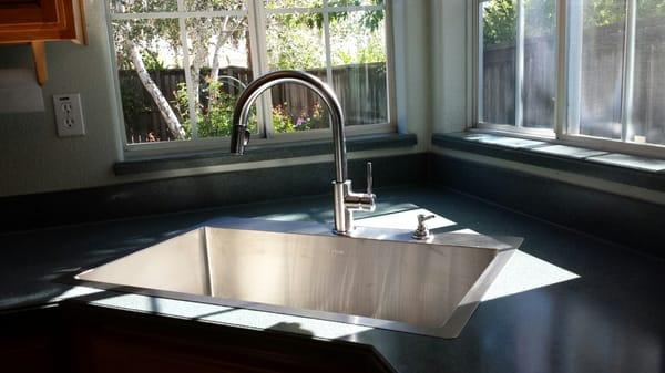 After photo...gorgeous large and deep one bowl sink with Delta faucet and soap dispenser.