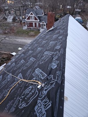 In progress corrugated metal roof.