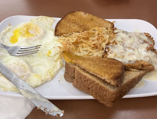 Chicken fried steak, eggs toast, hash browns