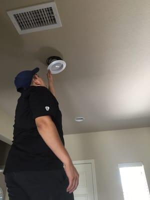 Co-Owner Eddie Aguilar installing a new LED downlight in our clients home.