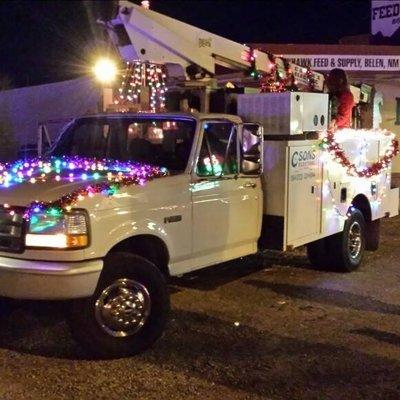 Getting into the Christmas spirit by decorating our bucket truck for the Light Parade in Belen.