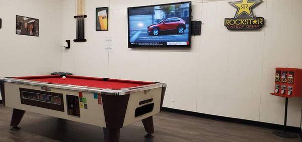 Inviting waiting area with Live sports and pool table