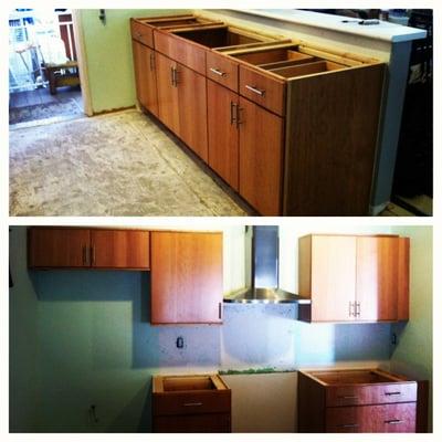 Custom made cabinets w/ cherry Slab Style Doors. Cabinets Installed by AMK Construction