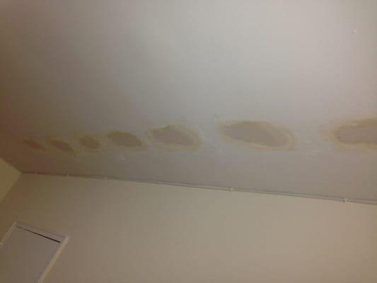 These are the holes made into my ceiling which were never mentioned prior to starting their "work".