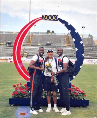 Luis Sr. with  the Harrison twins at the 2000 Olympics. Luis had been their trainer and helped them receive their Olympic medals