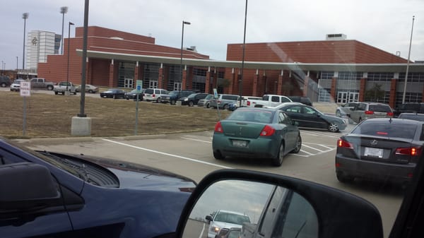 The pick up driver setting a perfect example as he parks in handicapped parking while waiting for his students to arrive.