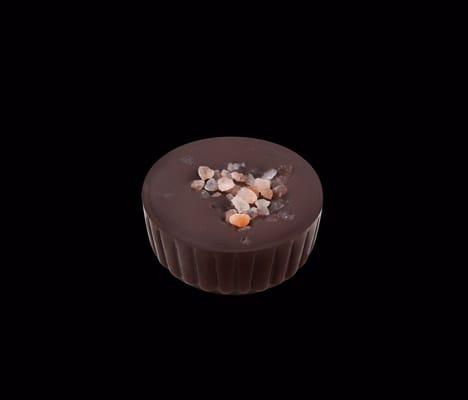 Caramel Opulence - 66% dark chocolate shell filled with in-house prepared liquid caramel topped with Himalayan sea salt