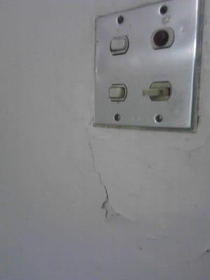 WTF kind of light switch is this?... cracks on the wall