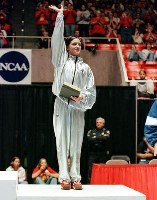 Theresa, a former NCAA All Around and Balance Beam Champion, featured at the 1999 NCAA Championships