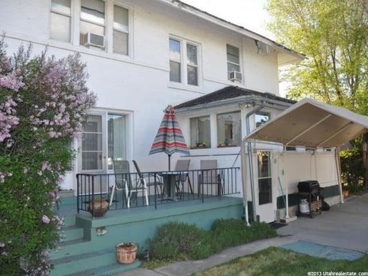 Back of Bed and Breakfast. Cute little porch and there is a trampoline for kids.