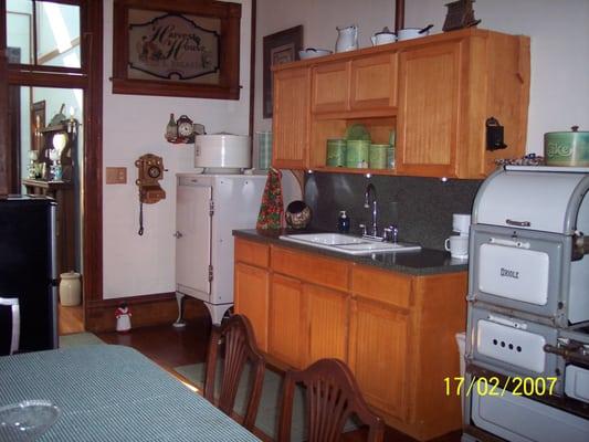 1929 style central kitchen and dining area.