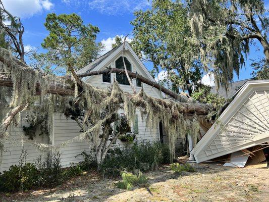 Tree fallen on house.