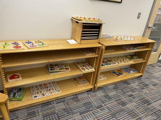 Discovery Room - shelf of puzzles