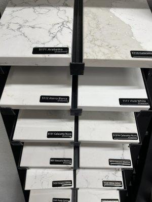 A few of our quartz countertop options in the showroom.