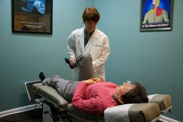 Dr Pamela J Owens working with a patient at At the Beach Chiropractic