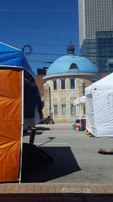 Blue dome and vendor tents.