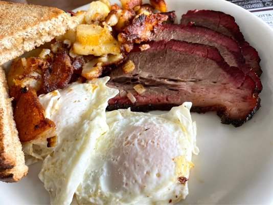 Smoked brisket with eggs over easy