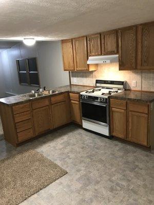 New cabinets, flooring & sink