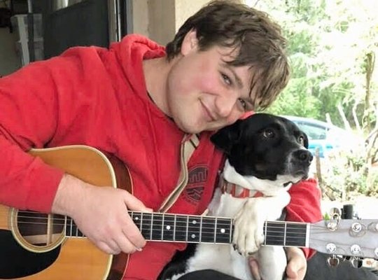 Teaching guitar to my dog Max