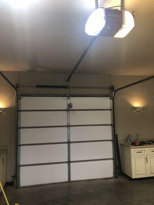 Garage door with new insulation and belt driven lift master opener with IQ technology and battery backup.