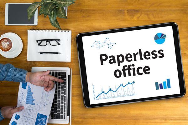 Paperless office reduces reliance on physical documents, enhancing efficiency and sustainability through digital processes.