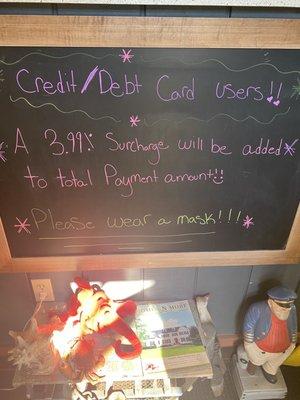 Sign when you walk in the door...I think they are called Debit cards and this is the % sign