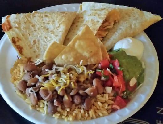 Quesadilla w/ chipotle chicken and sides of rice w/ beans, pico de gallo, guacamole, & sour cream.