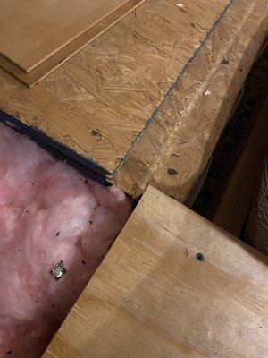 Stacked and nailed boards, exposed insulation in main walkways - after paying $800 for a deck in a part of the attic you can get to