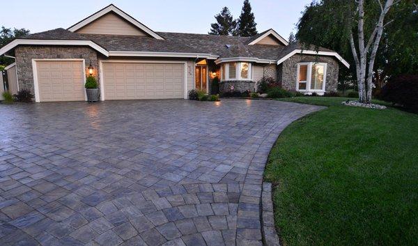 Calstone pavers with circle cut details add visual interest and style to a driveway.