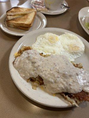 Smothered hash browns eggs and toast 10$