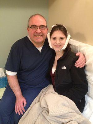 Dr. Alman and his daughter after having her wisdom teeth removed.