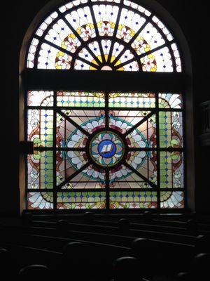 Church windows were made circa 1889 by Millet, a contemporary of Tiffany's.