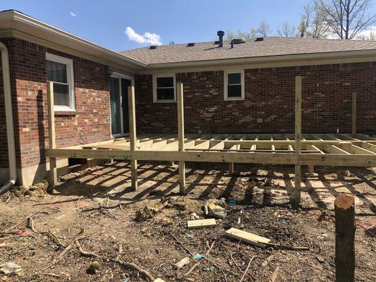 old deck torn down New framing being built