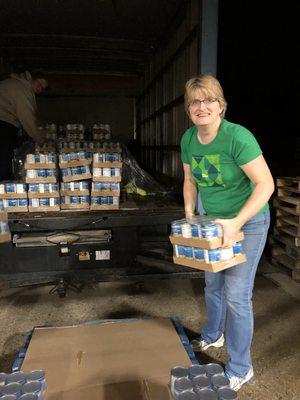 Valerie is helping unload boxes at the Bread of Life Food Pantry.