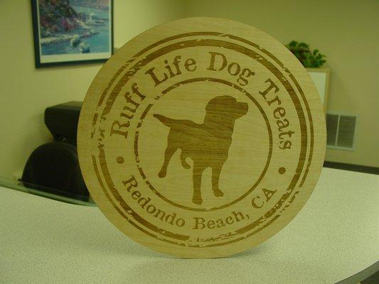 Laser Engraving on 18" diameter wood sign.