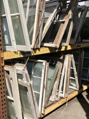 Architectural salvage window frames, some with glass some without...