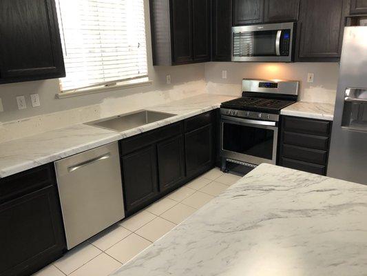 Countertops installed (I patched the walls)