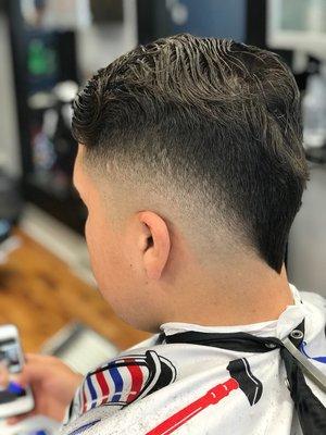 Drop V fade with scissor combover.