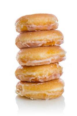 Stacks of yummy donuts.