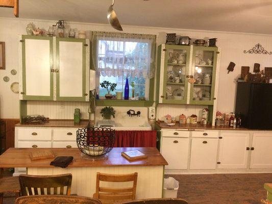 look at this sweet kitchen at Largilliere Carriage B&B full of antiques