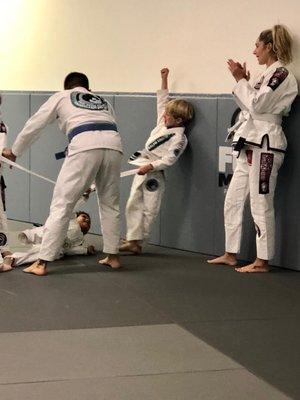 BJJ kids class led by Professor Regis.  Playing a game of tug of war.