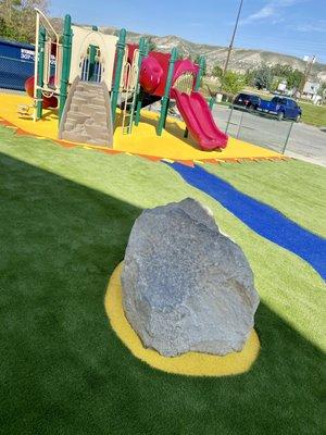 Poured rubber surface with SYNLawn artificial turf