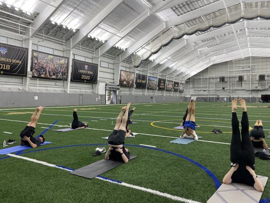 Incorporate a guided yoga class into your next company retreat. Yoga in Foley Indoor Athletic Center is a great start to any day.