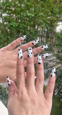 Cow print nails with small heart detail