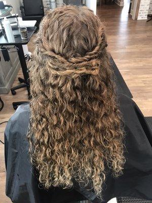 Twist half up on natural curly hair.