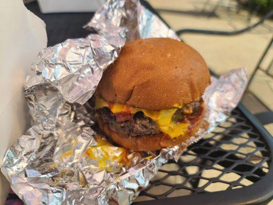 An absolutely delicious Cheeseburger made with Waygu beef.