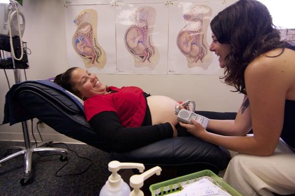 Certified nurse midwife sees a patient.