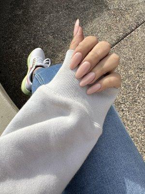 Fresh set of neutral colored acrylic nails, medium almond by Tommy